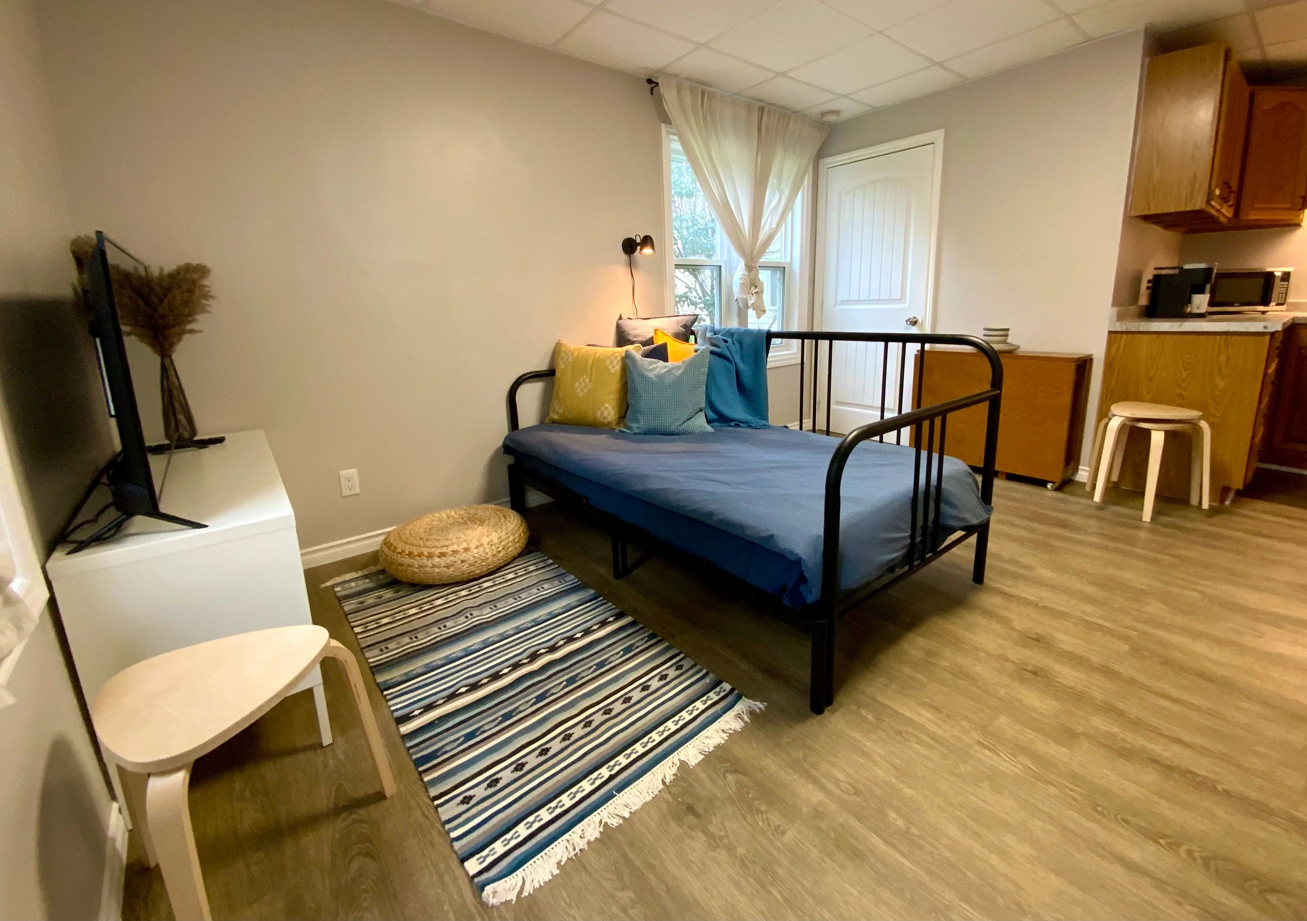 Renovated studio apartment living area in Simcoe